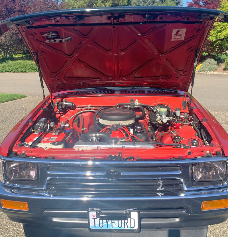 Load image into Gallery viewer, Engine bay of Toyota Pickup with Spiker hood struts