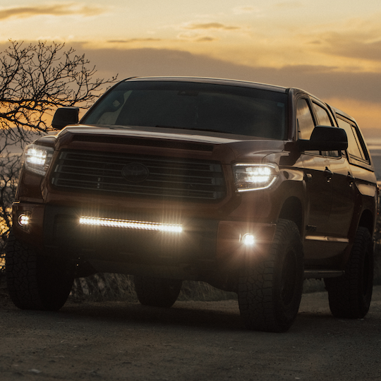 Load image into Gallery viewer, clear behind the grille light bar mounted on a toyota tundra