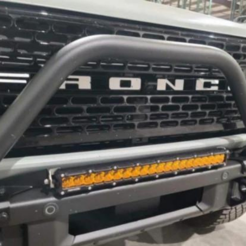 Load image into Gallery viewer, 20 inch bumper led light bar in amber on a ford bronco