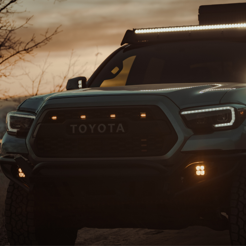 Load image into Gallery viewer, quattro led pod light mounted on a toyota tacoma as a fog light