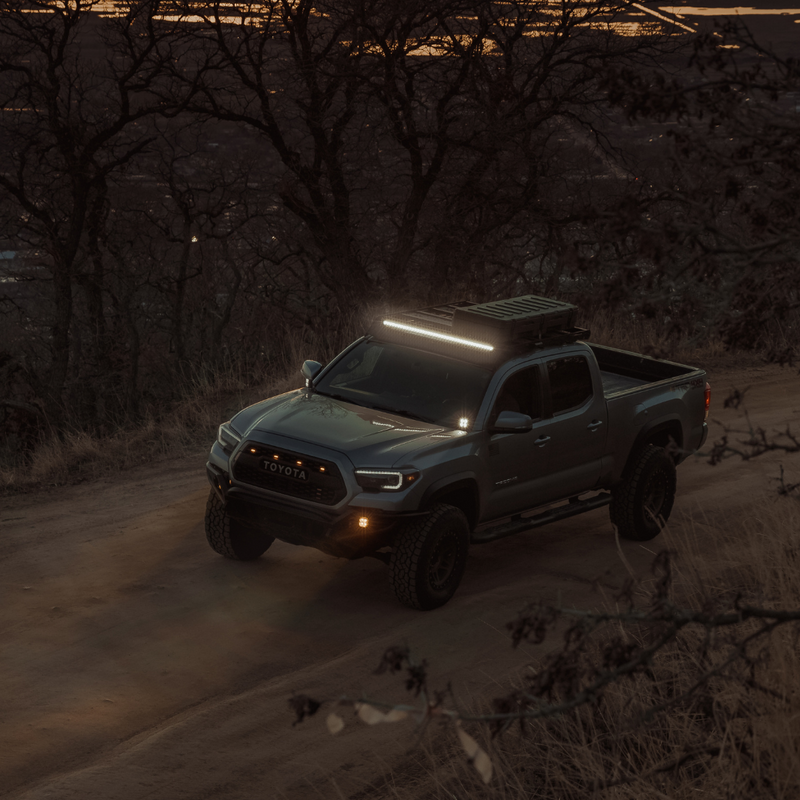 Load image into Gallery viewer, quattro led pod light mounted on a toyota tacoma as a fog light