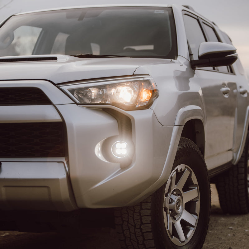 Load image into Gallery viewer, Heretic LED fog light kit mounted on a 4runner