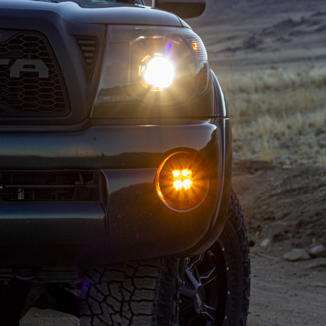 Load image into Gallery viewer, amber led fog light kit mounted on a toyota tacoma