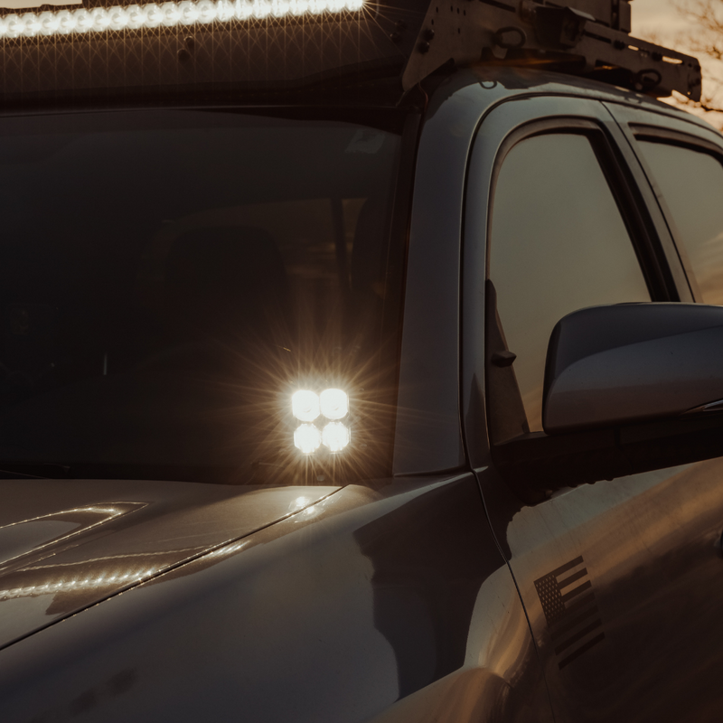 Load image into Gallery viewer, quattro led pod light mounted on a toyota tacoma as a ditch light