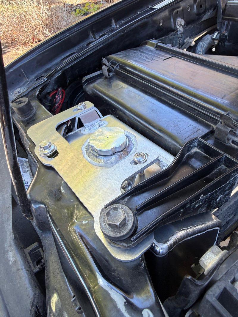 Load image into Gallery viewer, Snowbound Customs aluminum washer fluid reservoir installed in a Toyota engine compartment
