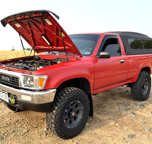Spiker hood struts installed on a Toyota Pickup