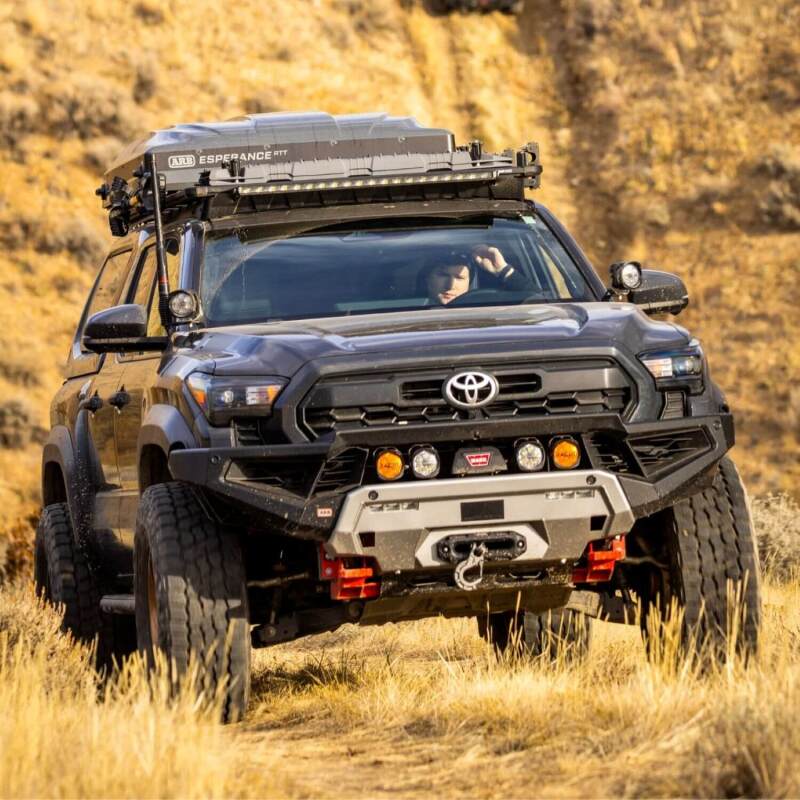 Load image into Gallery viewer, Toyota Tacoma with Old Man Emu BP-51 suspension off road
