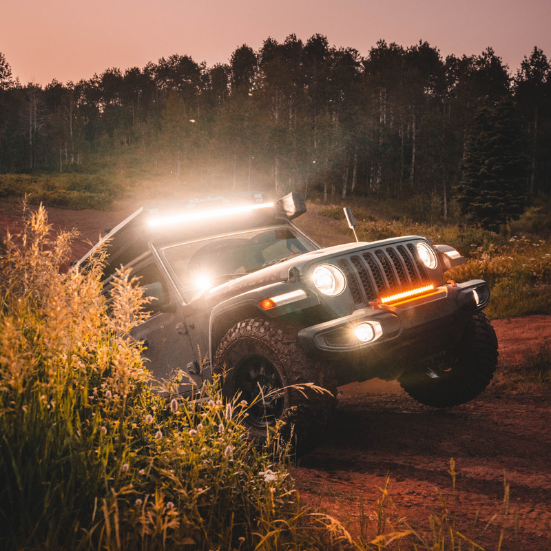 Load image into Gallery viewer, quattro led lights mounted as a ditch light on a jeep
