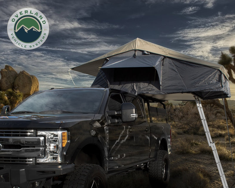 Load image into Gallery viewer, Roof Top Tent 4 Person Extended Roof Top Tent Dark Gray Base With Green Rain Fly With Bonus Pack Nomadic Overland Vehicle Systems - Overland Vehicle Systems
