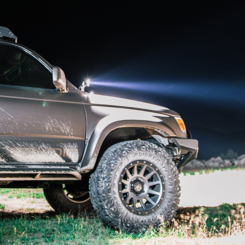 Load image into Gallery viewer, heretic&#39;s ba-2 pod light mounted as ditch lights on a toyota
